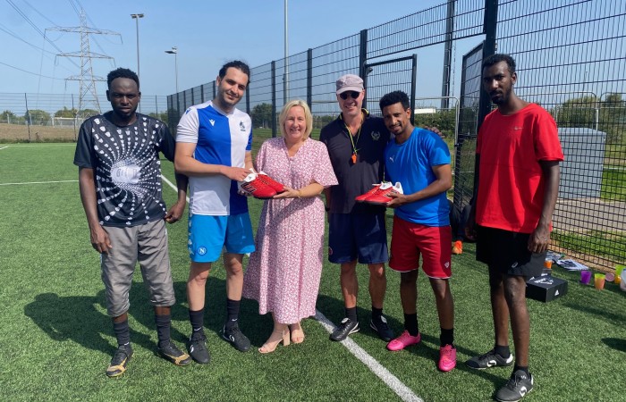 NEW FOOTBALL BOOTS GIVE REFUGEES SOMETHING TO AIM FOR